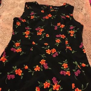 Black dress with colorful flowers all over it